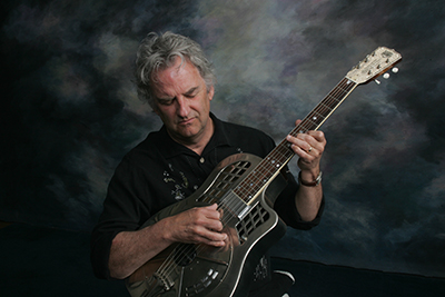 Mike Dowling with guitars